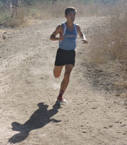 Varsity runner Misael Bolanos, 11, paces himself as he works towards the finish line at the Cluster One Meet.