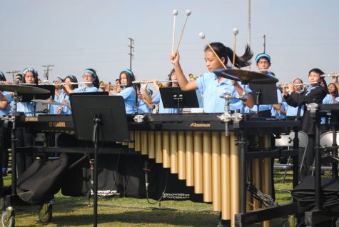 Section leader, Carol Luong,12, leads the front ensemble persuccion.