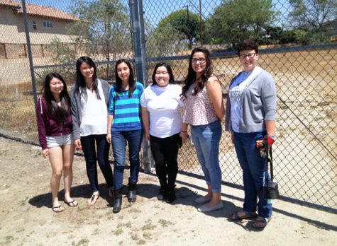 Savana Lam, Mabel Troung, Tiffany Duong, Stephanie Tang and Brianna Martinez pose with adviser Ms. Jennifer Swanson for a picture before they start their long day of gardening. 