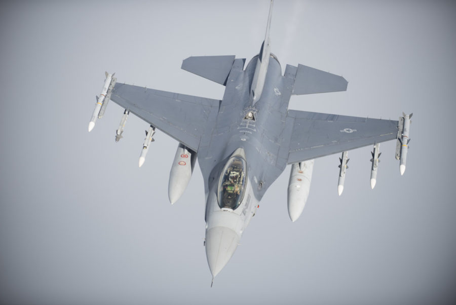 An F-16C Fighting Falcon flies below a KC-135 Stratotanker, April 15, 2018. U.S. Air Forces in Europe-assigned aircraft conducted refueling support and defensive counter air operations to support combined air and maritime forces in the Mediterranean Sea during U.S. military strikes in Syria.  (U.S. Air Force photo by Tech. Sgt. Emerson Nuñez)