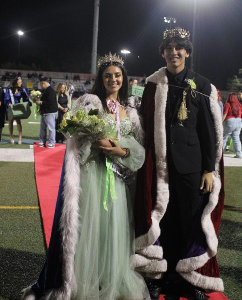 Newly crowned Homecoming royalty, Zulani Valencia and Axcel Garcia wait to greet their public.