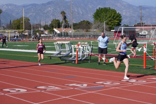 Daisy Hake (12), placing 1st in the girls varsity 400m race at the League meet against Rosemead. 