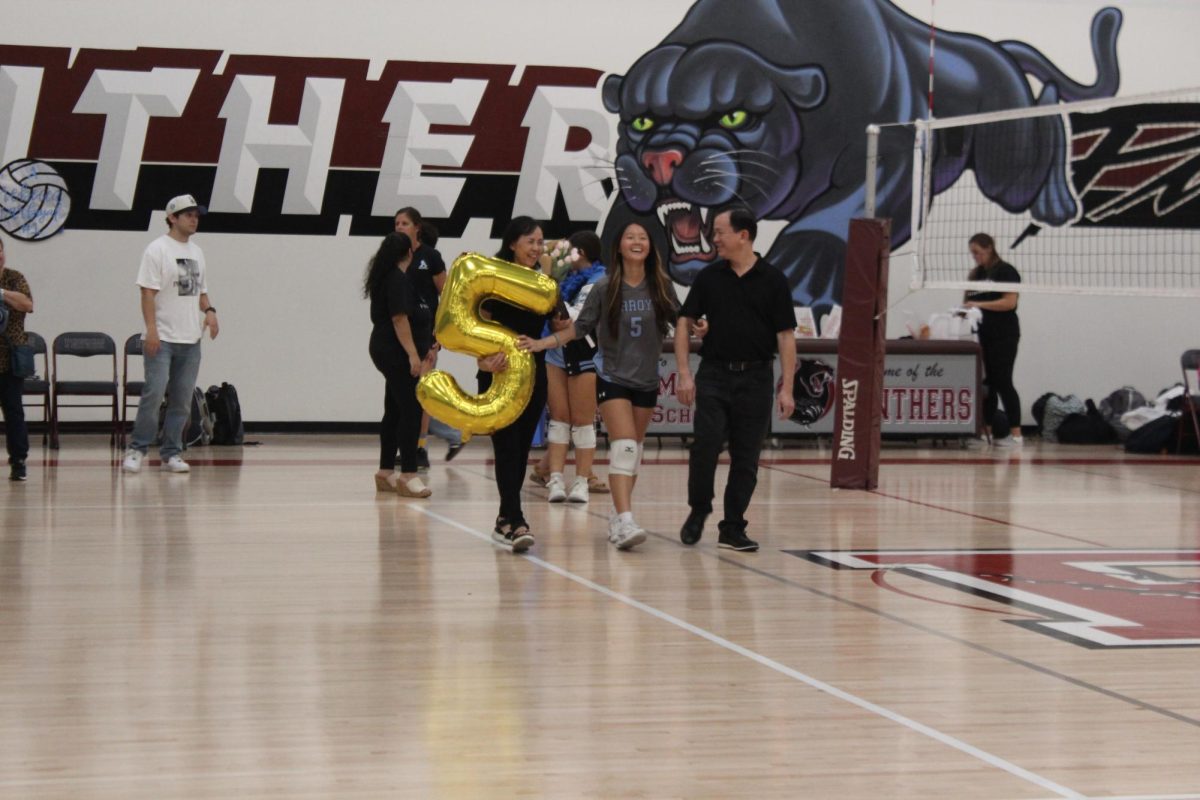 Senior Nghi Nguyen celebrating her last year on the volleyball team at senior night.