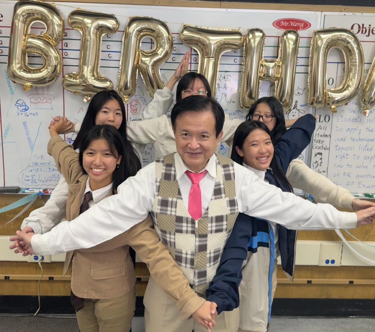 Mr. Wong celebrating his birthday with his students.