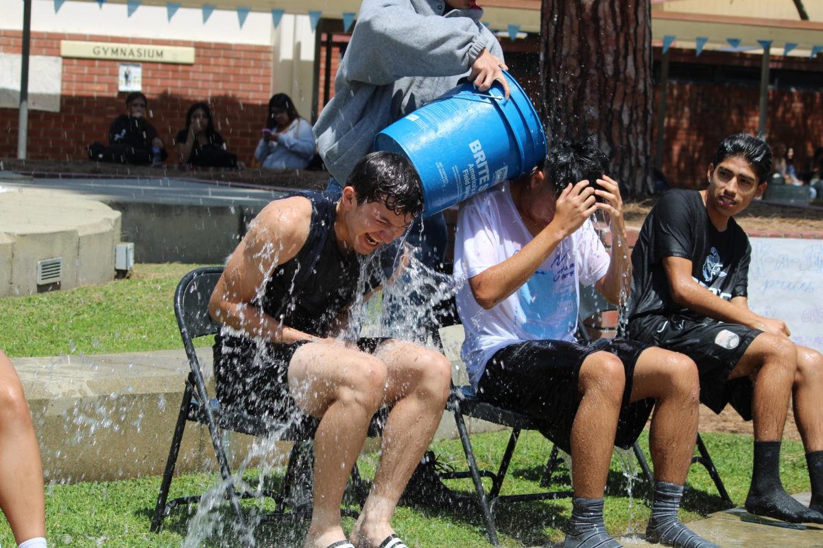 Richard Cobian Smiles and laughs while Gary Chen gets splashed by Thomas Mach